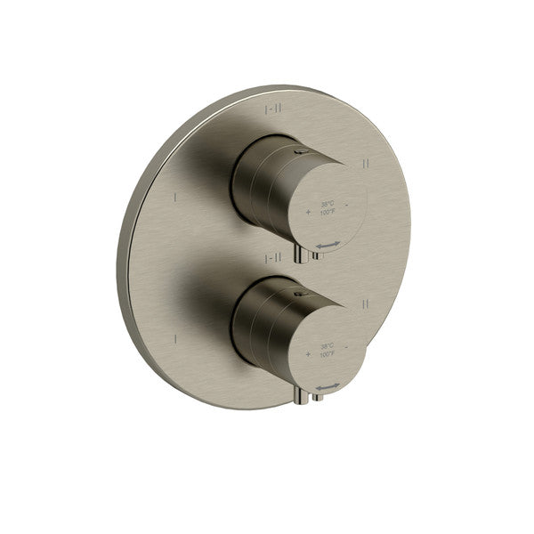 A modern shower control panel with two cylinder-shaped handles on a circular plate.