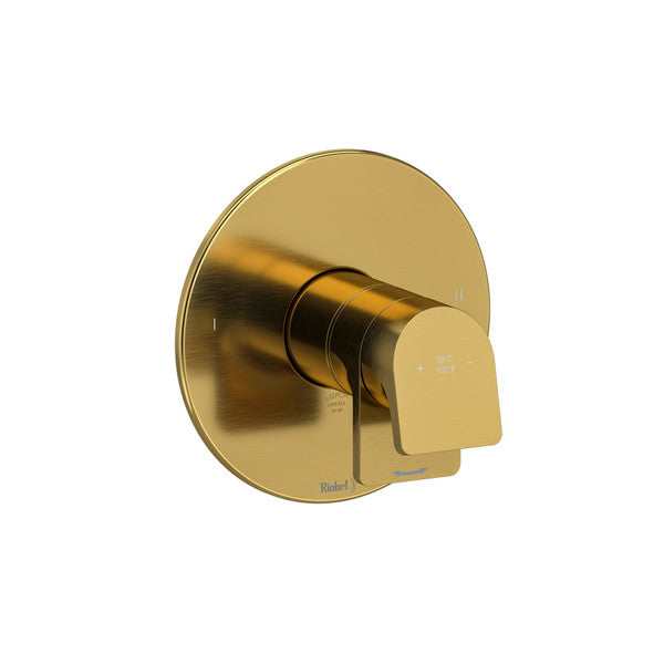 A modern gold faucet handle mounted on a circular base.